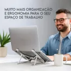 Base Suporte para Notebook prateado articulado com laptop.