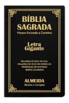 Bíblia Sagrada Letra Gigante preta, capa dura com detalhes dourados e harpa.