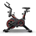 Bicicleta Ergométrica Spinning Redfin preta com detalhes vermelhos