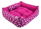 Cama Pet rosa com estampa de ossos brancos e almofada