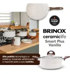 Conjunto de panelas Brinox Vanilla creme com alças marrons e tampas de vidro.