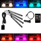 Kit Led Neon Rgb com 4 barras pretas, controle remoto e luzes coloridas no carro.