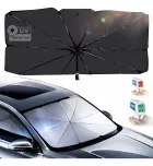 Quebra sol preto aberto e prateado no para-brisa do carro, com termômetros