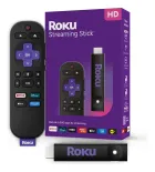 Roku Streaming Stick: controle remoto preto com botões roxos, stick preto e caixa roxa.