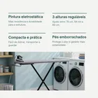 Tabua De Passar Roupa Reforçada Com Porta Ferro preta em lavanderia com ferro.